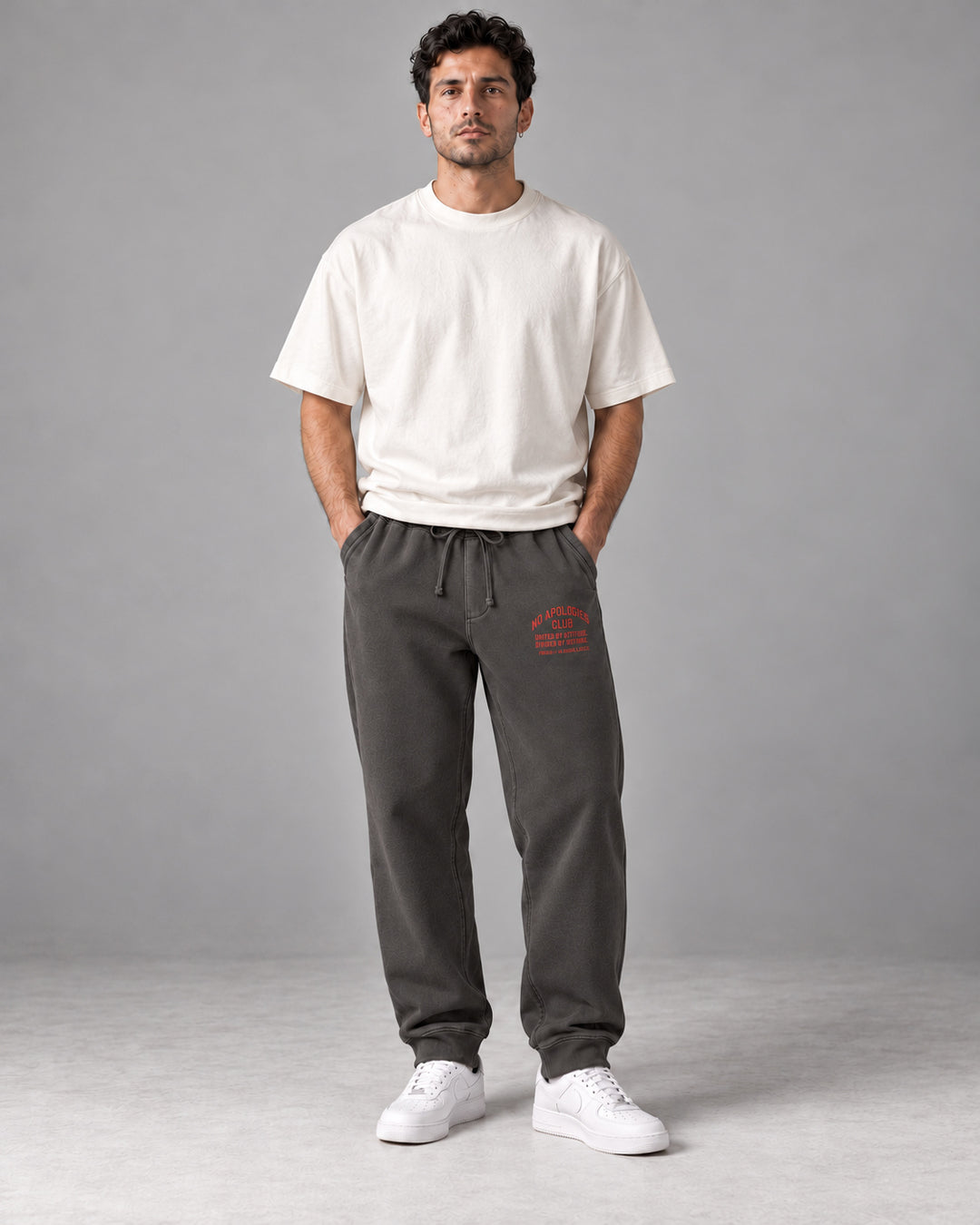 No Apologies pigment-dyed sweatpants in black, worn by a man