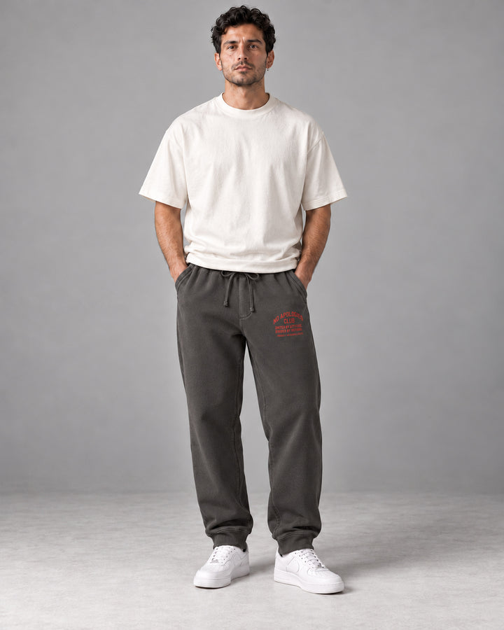 No Apologies pigment-dyed sweatpants in black, worn by a man