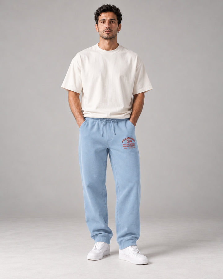 No Apologies pigment-dyed sweatpants in light blue, worn by a man